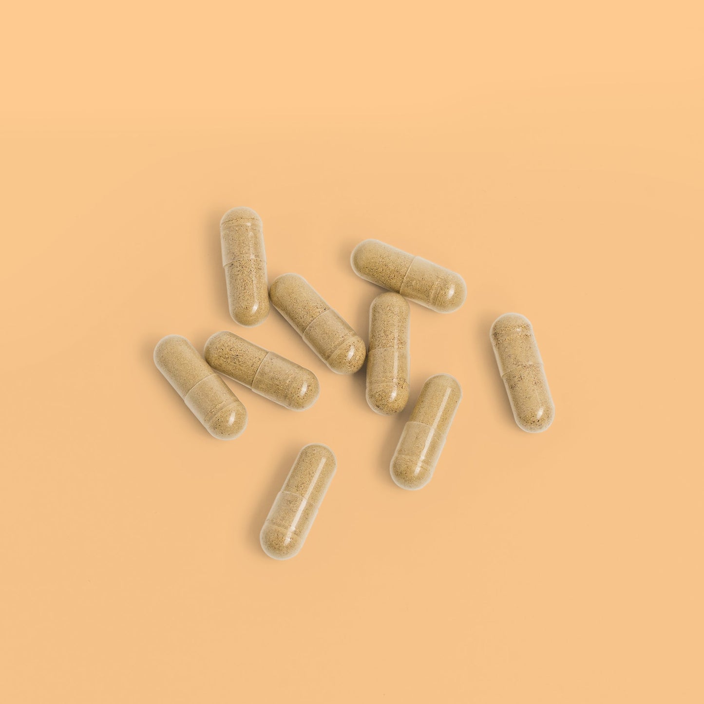 Close-up of Herbaly's Derma Hair, Skin & Nails + Biotin Capsules showing their size, shape, and color
