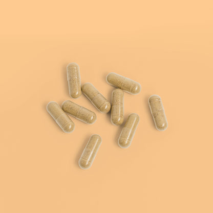Close-up of Herbaly's Derma Hair, Skin & Nails + Biotin Capsules showing their size, shape, and color