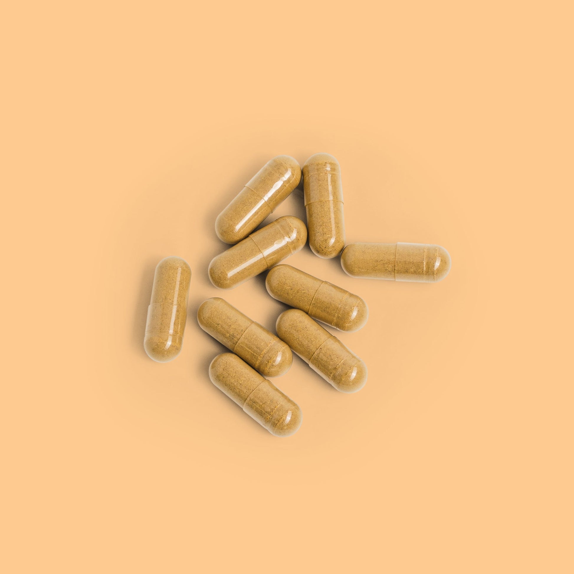 Close-up of Herbaly's Detox Liver Restore Complete Capsules showing their size, shape, and color